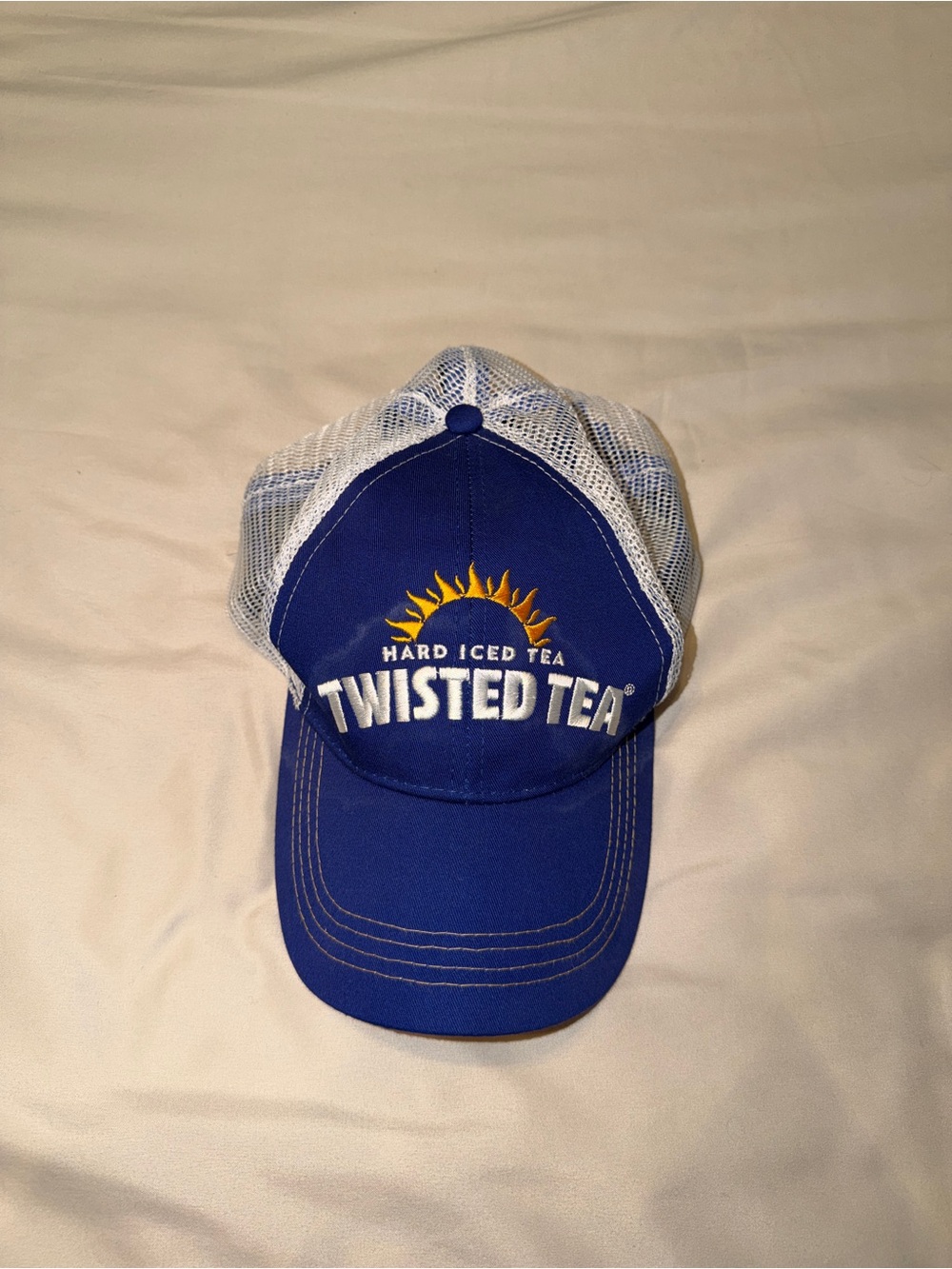 Twisted Tea Royal Blue and White Mesh Trucker Hat with Sun Logo